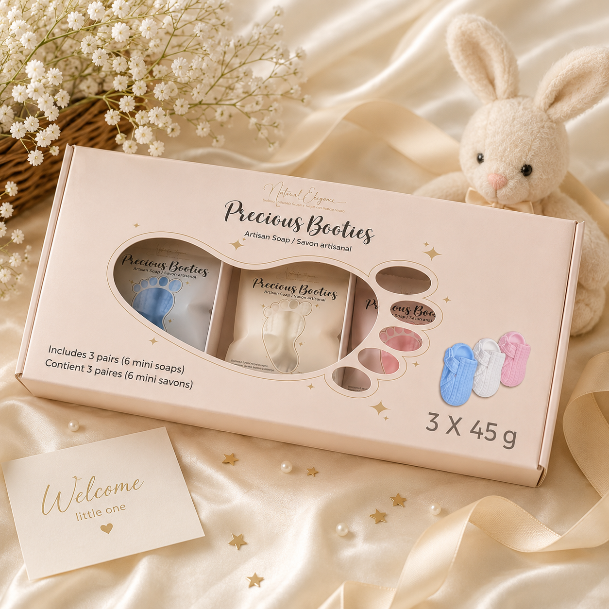 Precious Booties Trio Gift Box – three pairs of handcrafted mini soap booties in blue, white and pink, presented in a Natural Elegance keepsake gift box